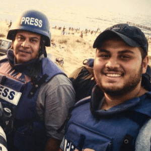 Hamza Wael al-Hadouh with his father