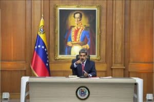 Nicolás Maduro, in front of the image of Venezuela's independence hero, Simón Bolívar, during a press conference at the Miraflores Presidential Palace in Caracas.